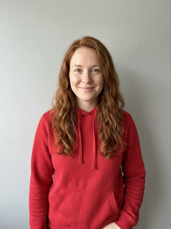 Input photo: an AI-generated portrait of a woman with red hair
